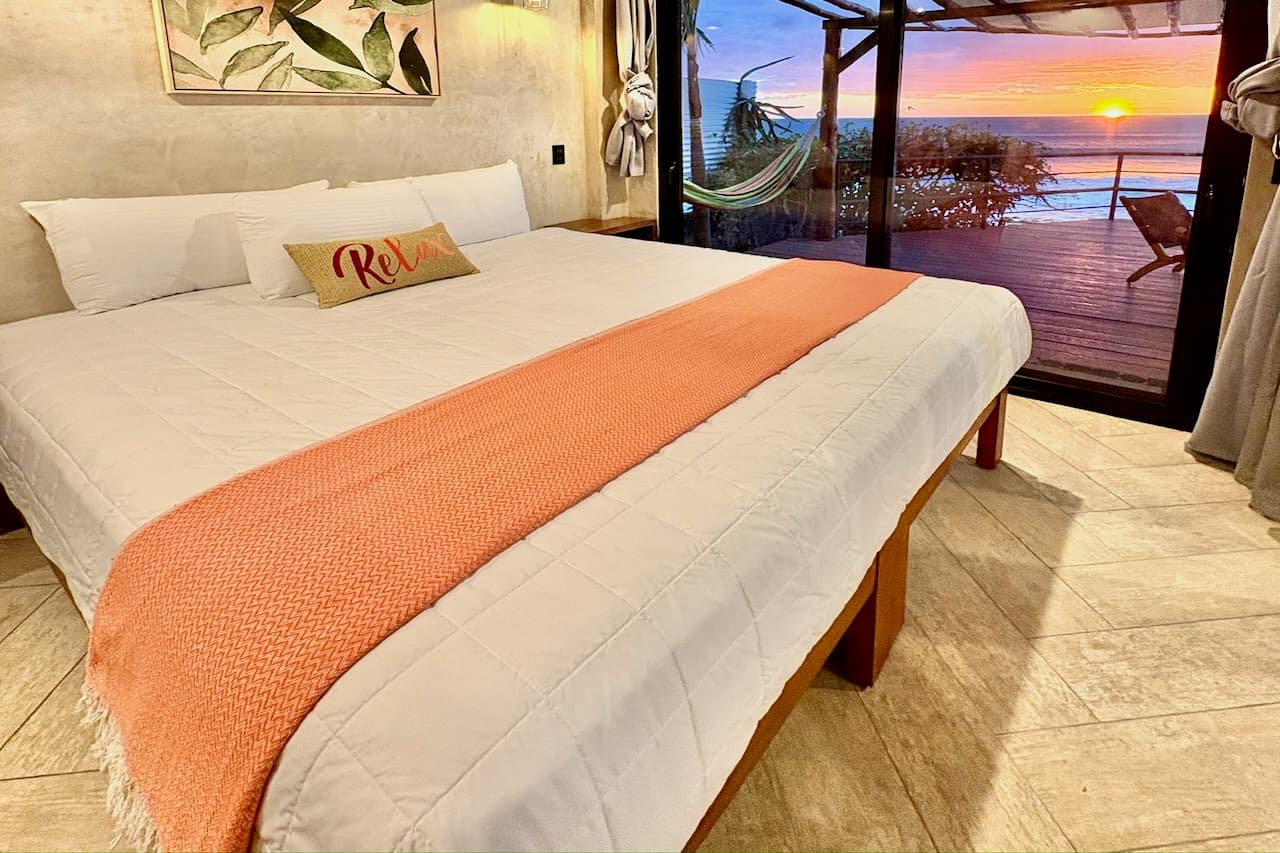 Ocean Master Room with ocean view and sunset at Miramar SurfCamp in Nicaragua